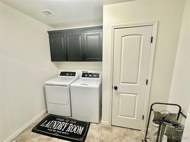 laundry room with separate washer and dryer, cabinet space, visible vents, and baseboards