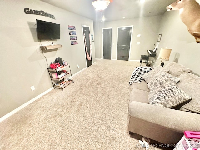 living room with carpet flooring and baseboards