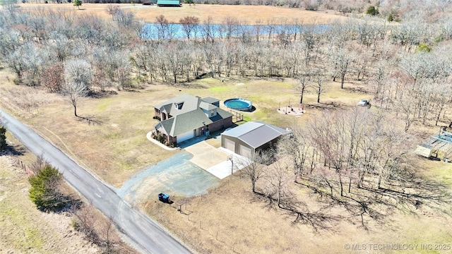 birds eye view of property with a rural view