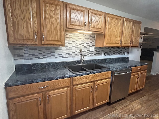 kitchen with dishwasher, dark wood-style flooring, backsplash, and a sink