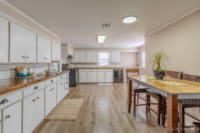 kitchen with crown molding, visible vents, light wood-style flooring, dishwasher, and stainless steel electric range