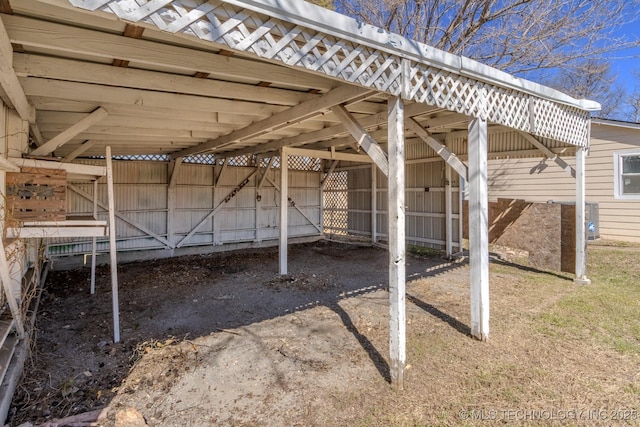 view of patio / terrace featuring a carport and driveway