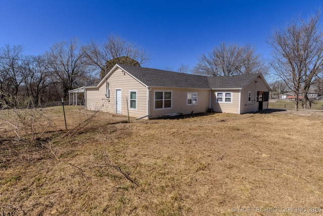 back of house with a yard