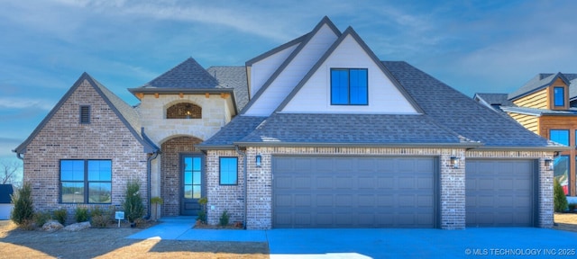 view of front facade featuring driveway, brick siding, roof with shingles, and an attached garage