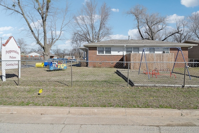 view of yard featuring a playground and fence