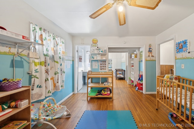 rec room featuring ceiling fan and wood finished floors