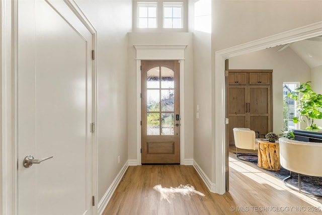 interior space with light wood-style flooring and baseboards