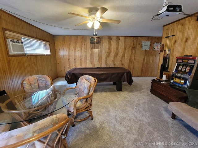 playroom featuring ceiling fan, pool table, wood walls, and carpet