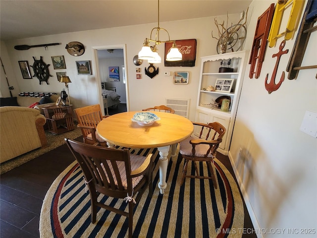 dining room featuring visible vents and baseboards