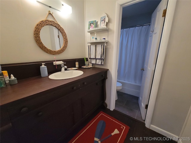 full bath featuring toilet, shower / tub combo with curtain, and vanity