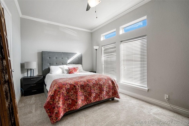 bedroom featuring ornamental molding, carpet, ceiling fan, and baseboards