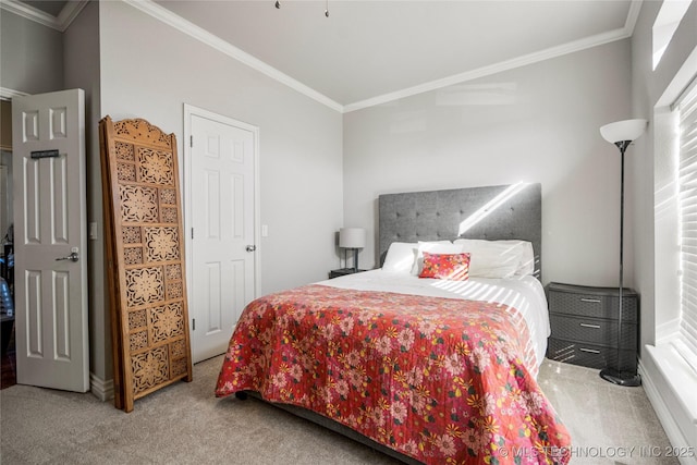 bedroom with carpet floors and ornamental molding