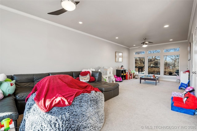 carpeted living area with a ceiling fan, recessed lighting, and crown molding