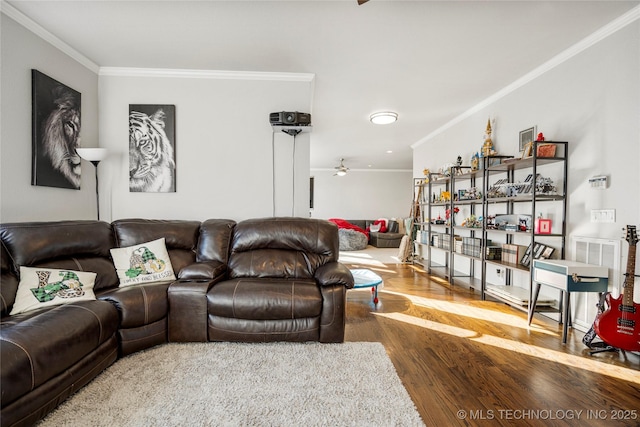 living area featuring ceiling fan, ornamental molding, and wood finished floors