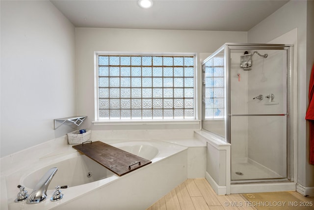 full bath featuring a stall shower and a bath