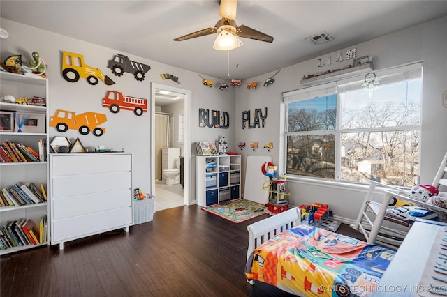 playroom featuring a wealth of natural light, visible vents, ceiling fan, and wood finished floors