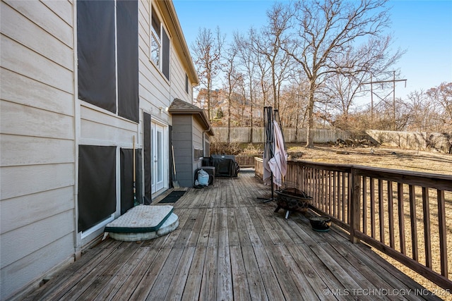 wooden deck featuring fence