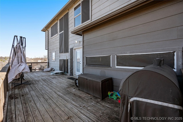 wooden deck with area for grilling