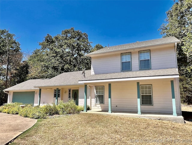 traditional-style home featuring a front yard, a porch, and roof with shingles