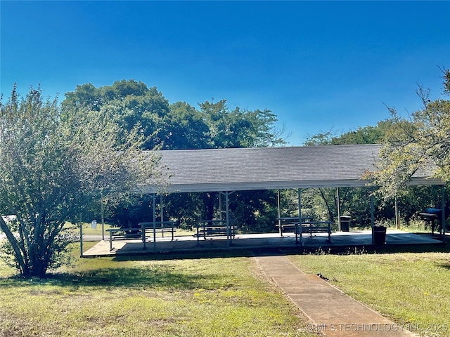 view of property's community with a yard