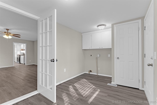 laundry room with ceiling fan, wood finished floors, baseboards, cabinet space, and electric dryer hookup