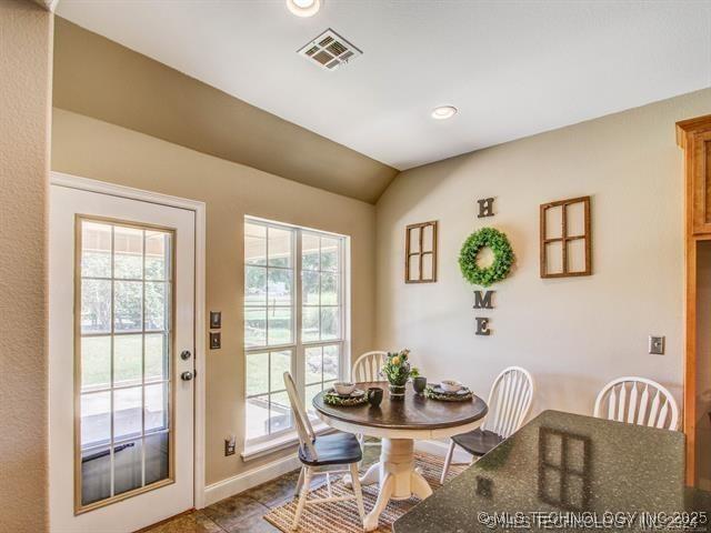 dining area with vaulted ceiling, baseboards, visible vents, and recessed lighting