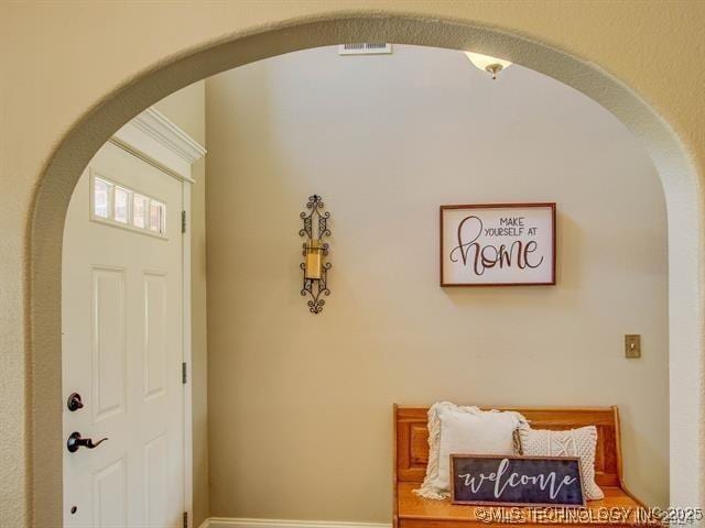 foyer featuring arched walkways