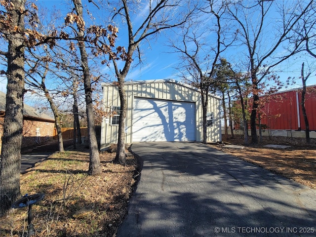 exterior space featuring aphalt driveway