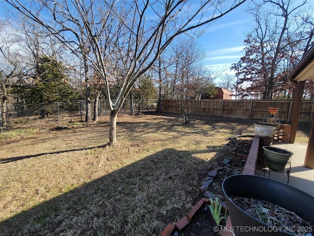 view of yard with a fenced backyard