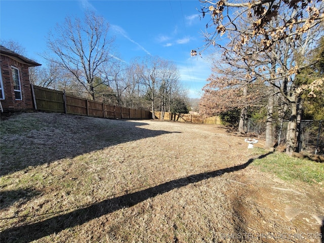 view of yard with a fenced backyard