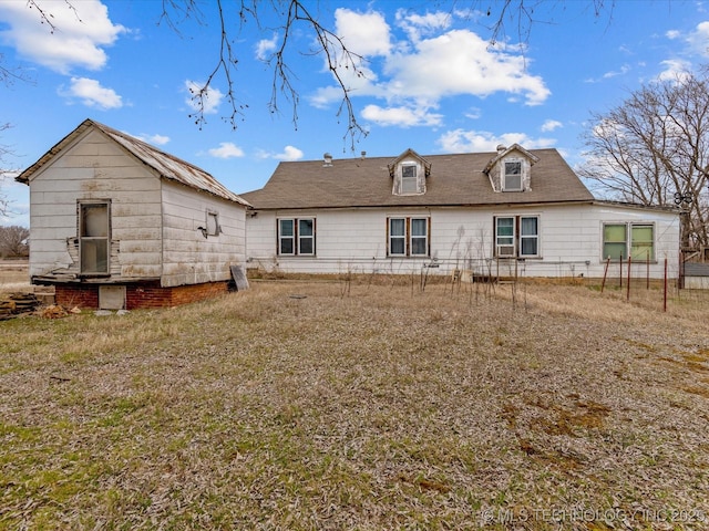 back of property featuring fence