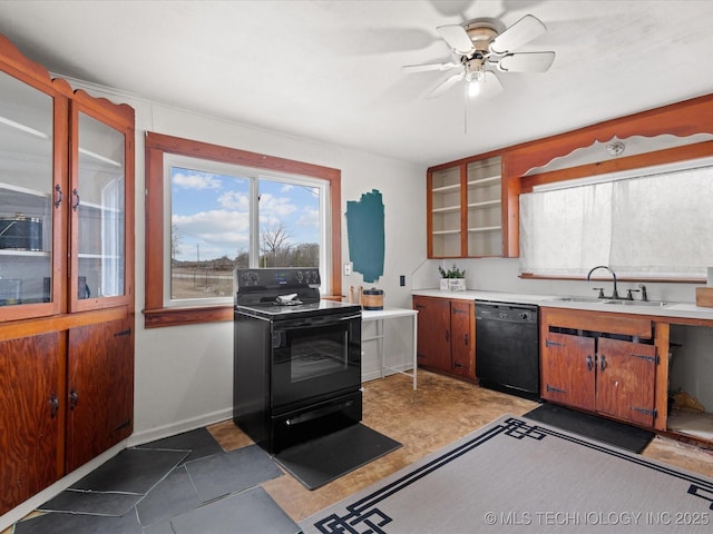 kitchen featuring brown cabinets, light countertops, a sink, and black appliances