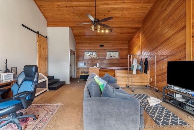 living room featuring high vaulted ceiling, a barn door, wooden ceiling, wooden walls, and a ceiling fan