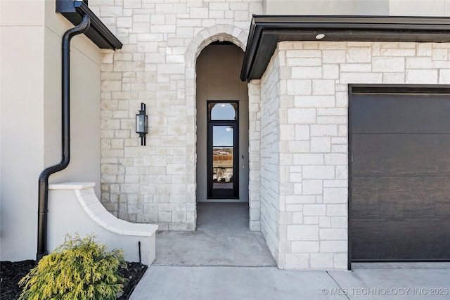 entrance to property featuring stone siding