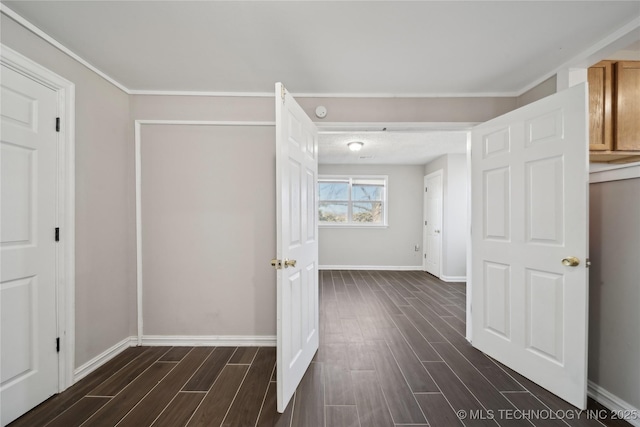 corridor featuring baseboards and wood tiled floor