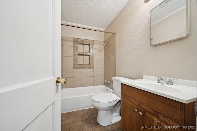 full bath with washtub / shower combination, toilet, vanity, tile patterned floors, and a textured ceiling