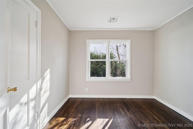 unfurnished room featuring visible vents, baseboards, dark wood-type flooring, and ornamental molding