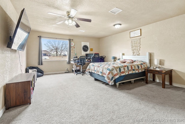 bedroom with visible vents, a textured ceiling, and carpet flooring