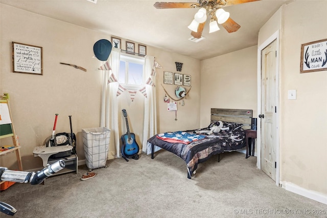 bedroom with carpet floors, visible vents, and ceiling fan