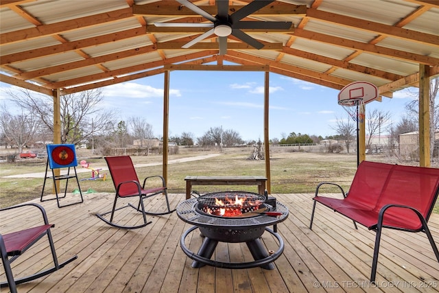 wooden deck with a fire pit