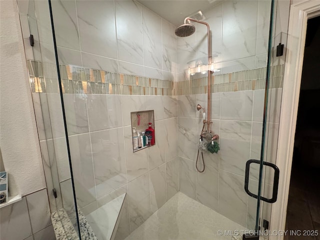 bathroom featuring a shower stall