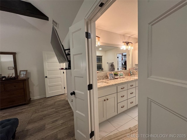 bathroom featuring visible vents and vanity