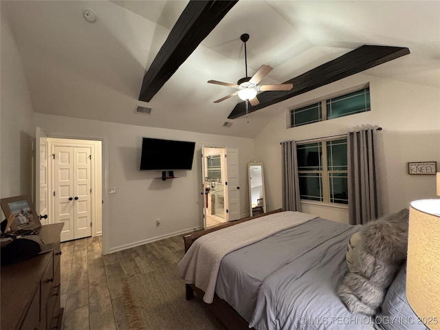 bedroom featuring lofted ceiling with beams, dark wood-type flooring, visible vents, and baseboards