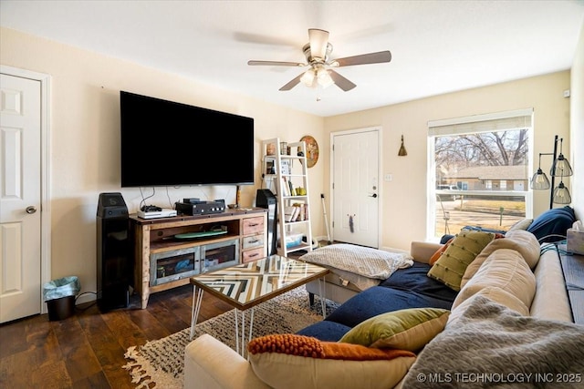 living room with dark wood-style floors and a ceiling fan