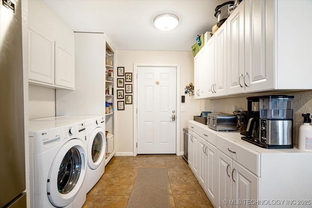 laundry room with baseboards and washer and clothes dryer