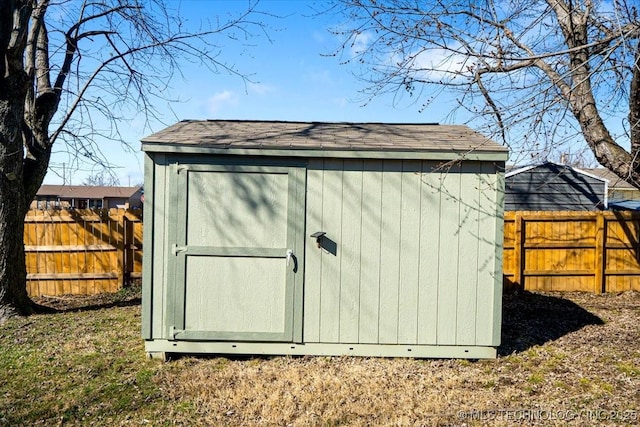 view of shed featuring a fenced backyard