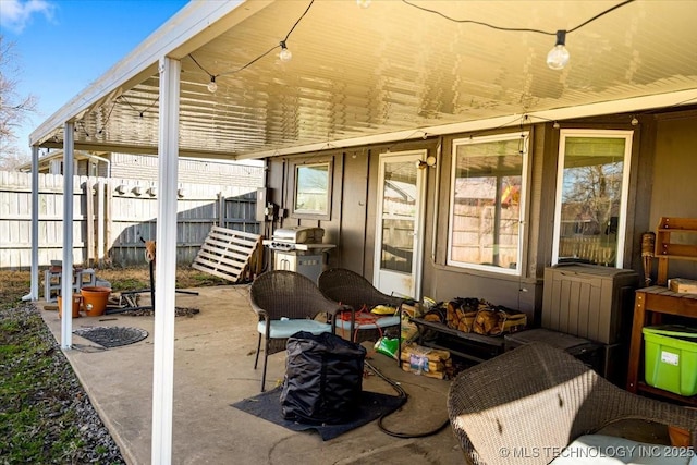 view of patio featuring fence and grilling area