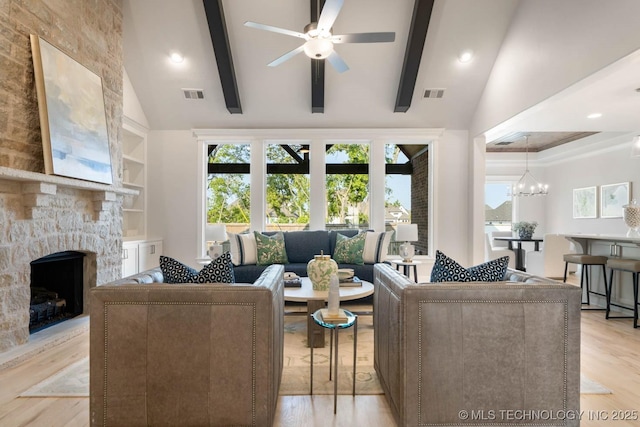 living area featuring plenty of natural light, light wood-style flooring, and visible vents