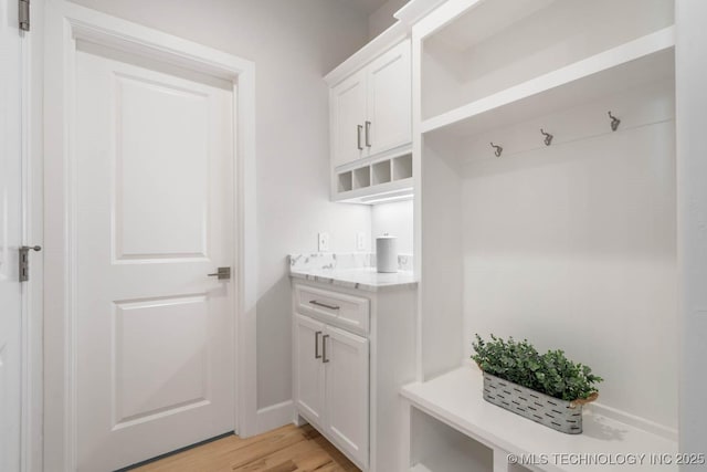 mudroom with light wood finished floors