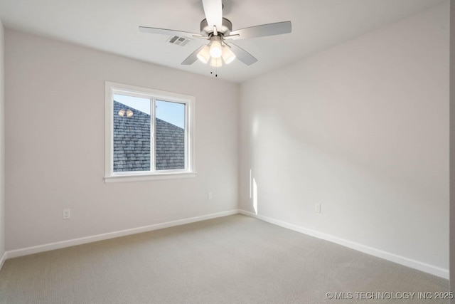 unfurnished room with light carpet, ceiling fan, visible vents, and baseboards